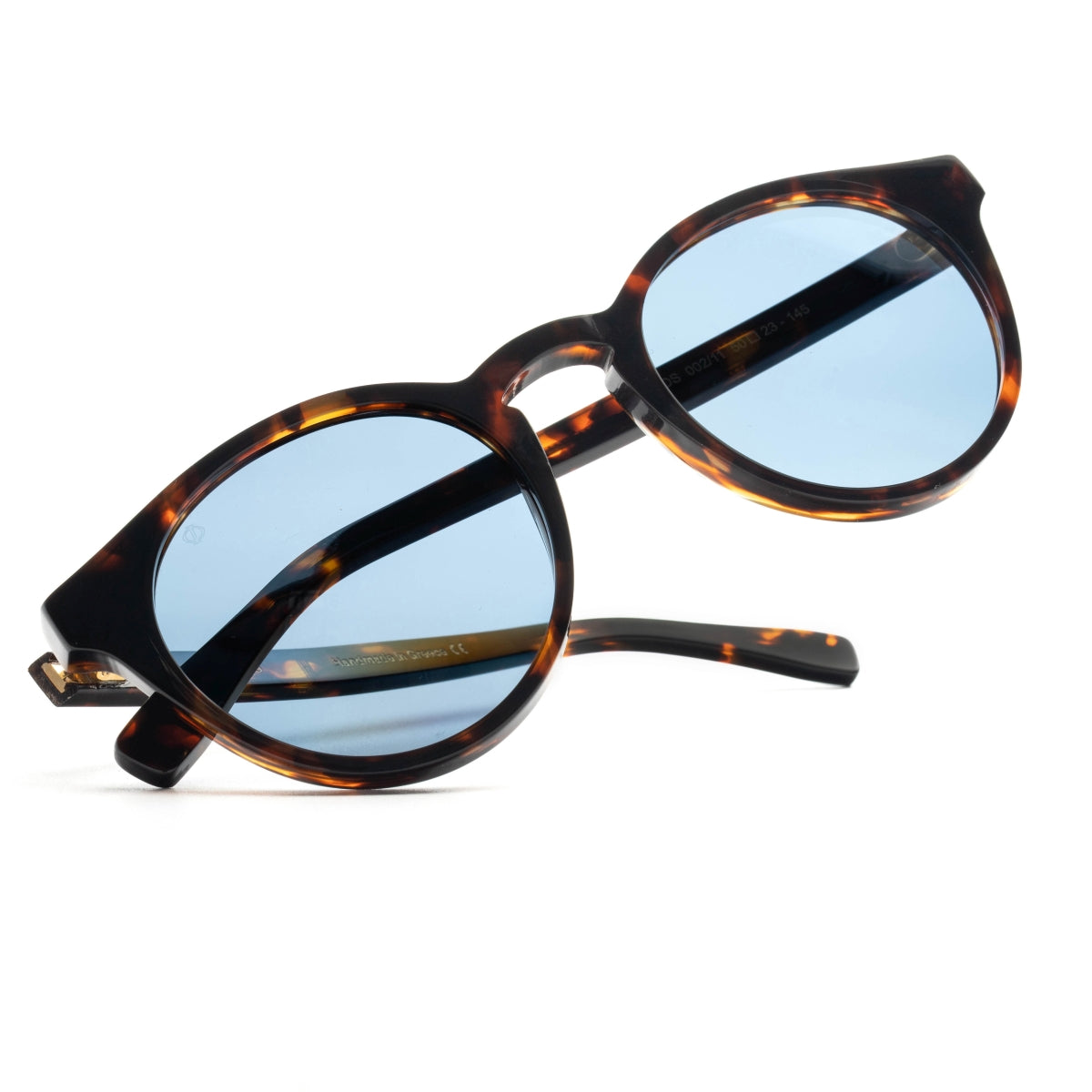 SYROS IN MARBLE BROWN WITH KYANO BLUE LENSES