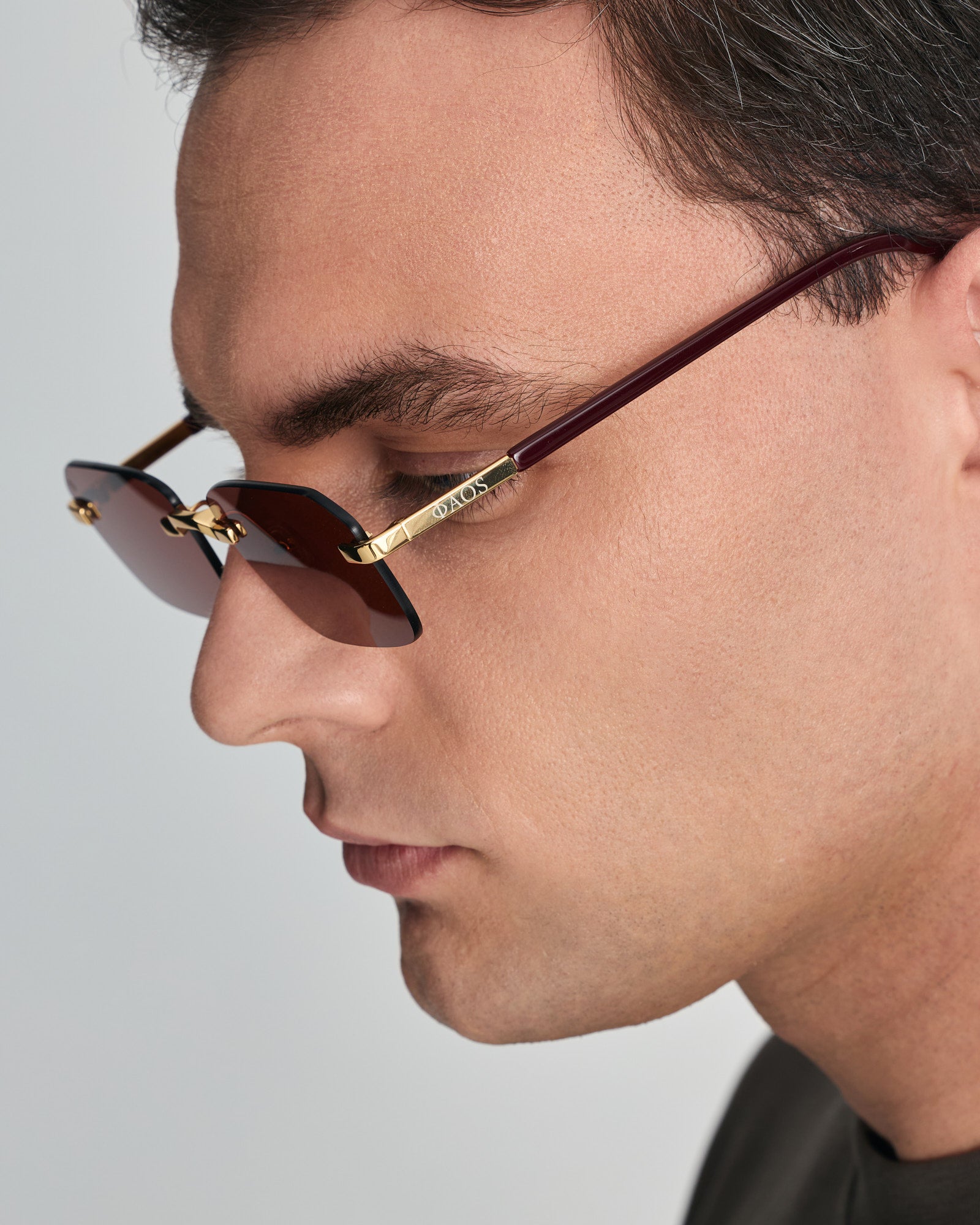 MYCENAE IN METALIC GOLD WITH MAROON LENSES