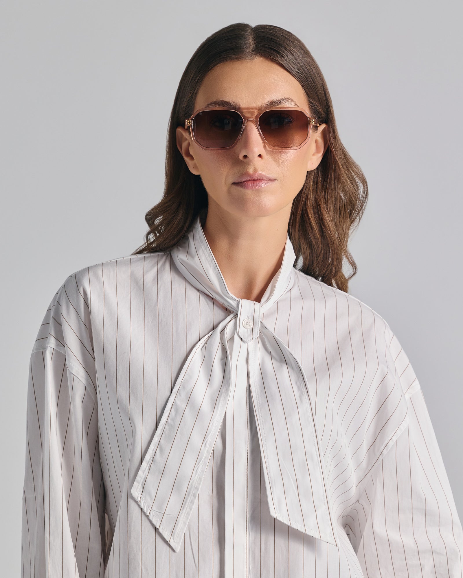 KYTHNOS IN CRYSTAL PINK WITH SUNSET BROWN LENSES